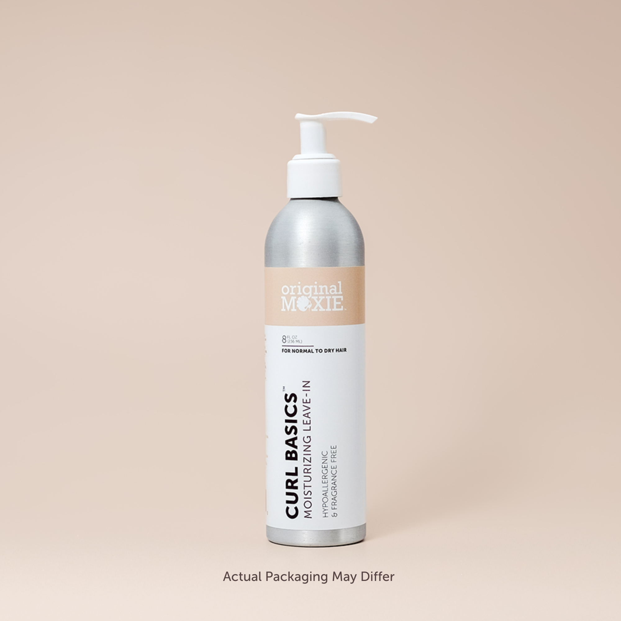 Bottle of Original Moxie Curl Basics Leave-in on a beige background