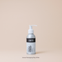 Bottle of 'Original Moxie' shampoo on a beige background